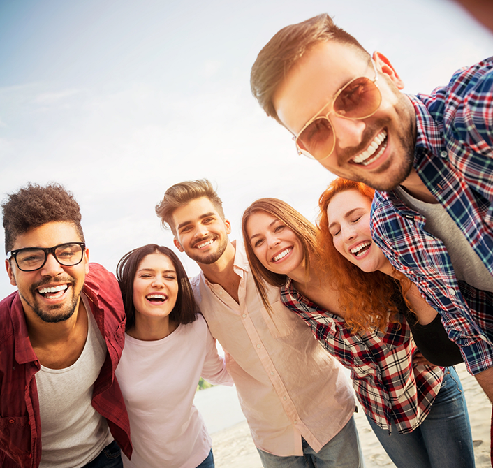 Group of adults smiling outdoors